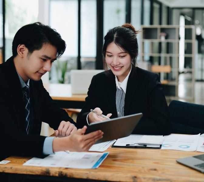 Business People Meeting to analyse and discuss and brainstorming the financial report chart data in